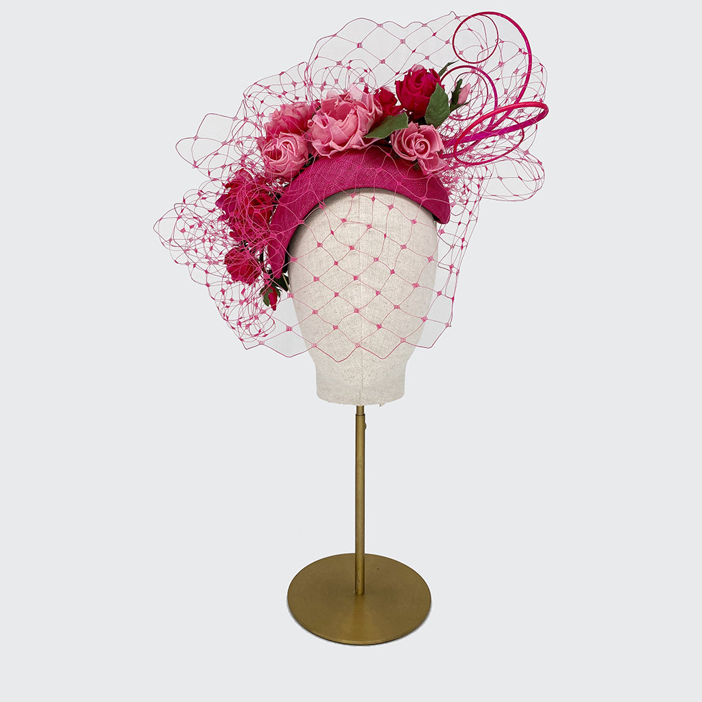 Pink crescent with handmade roses, quills and veiling