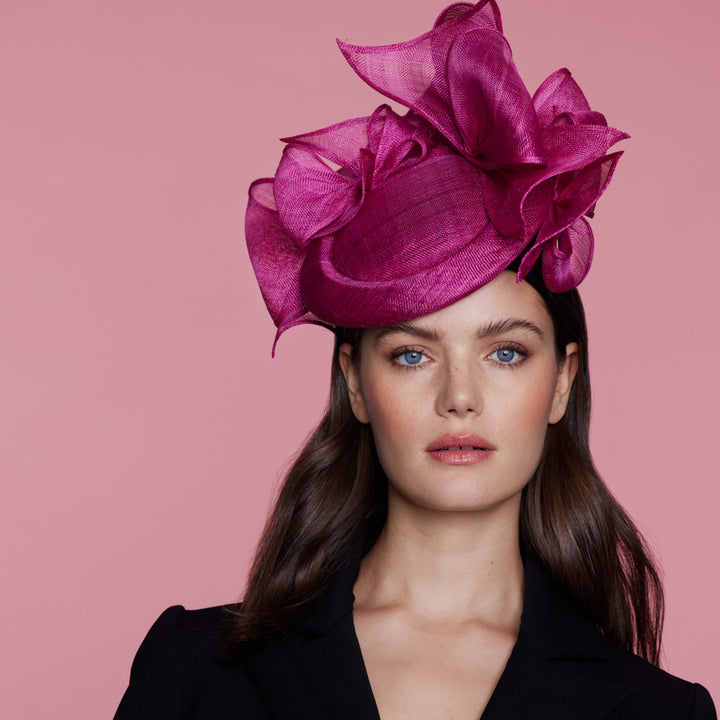 Deep pink straw button pillbox with rolled bows