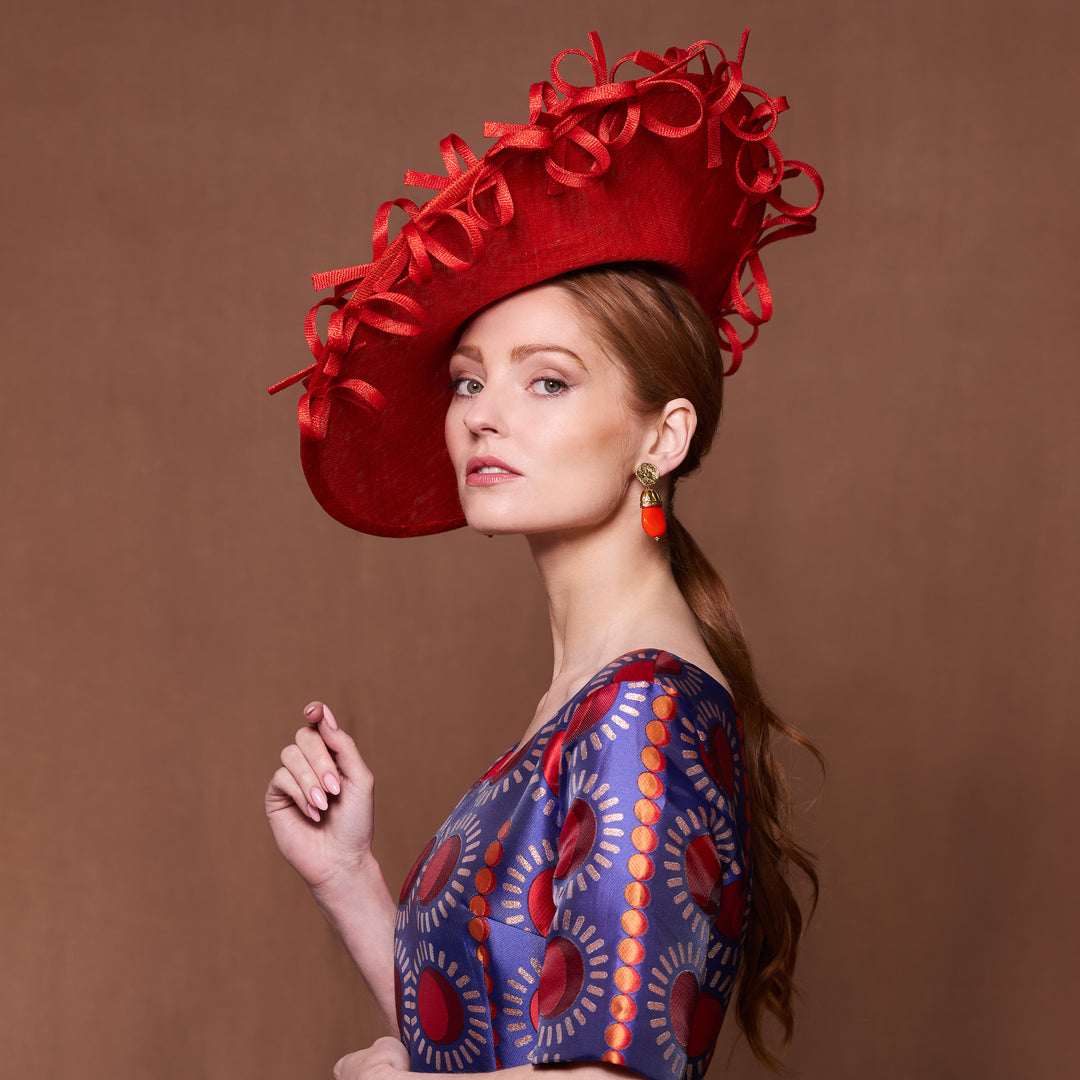 Burnt orange fine straw disc with bow twist edge