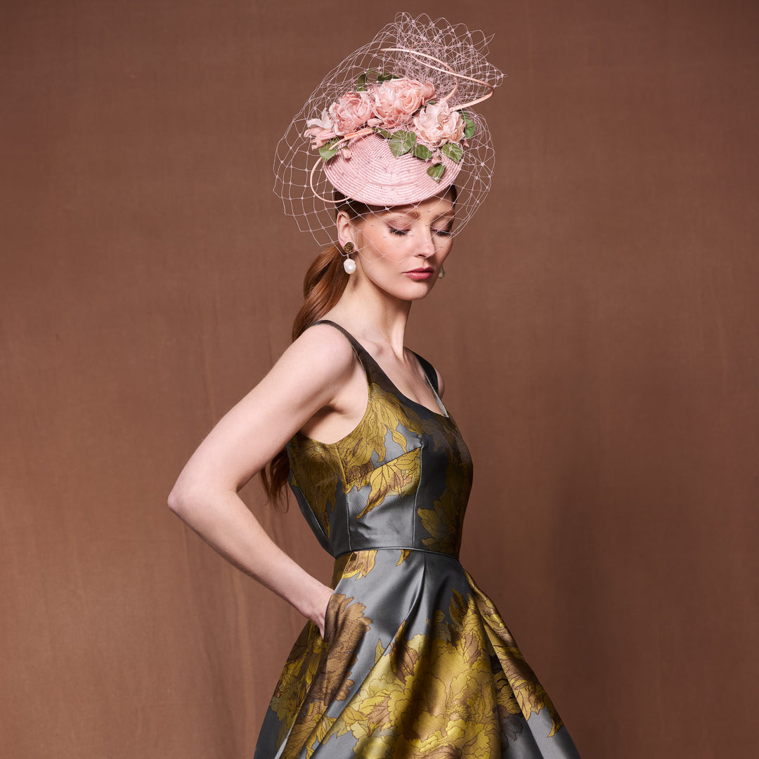 Apricot straw button pillbox with silk roses and veiling