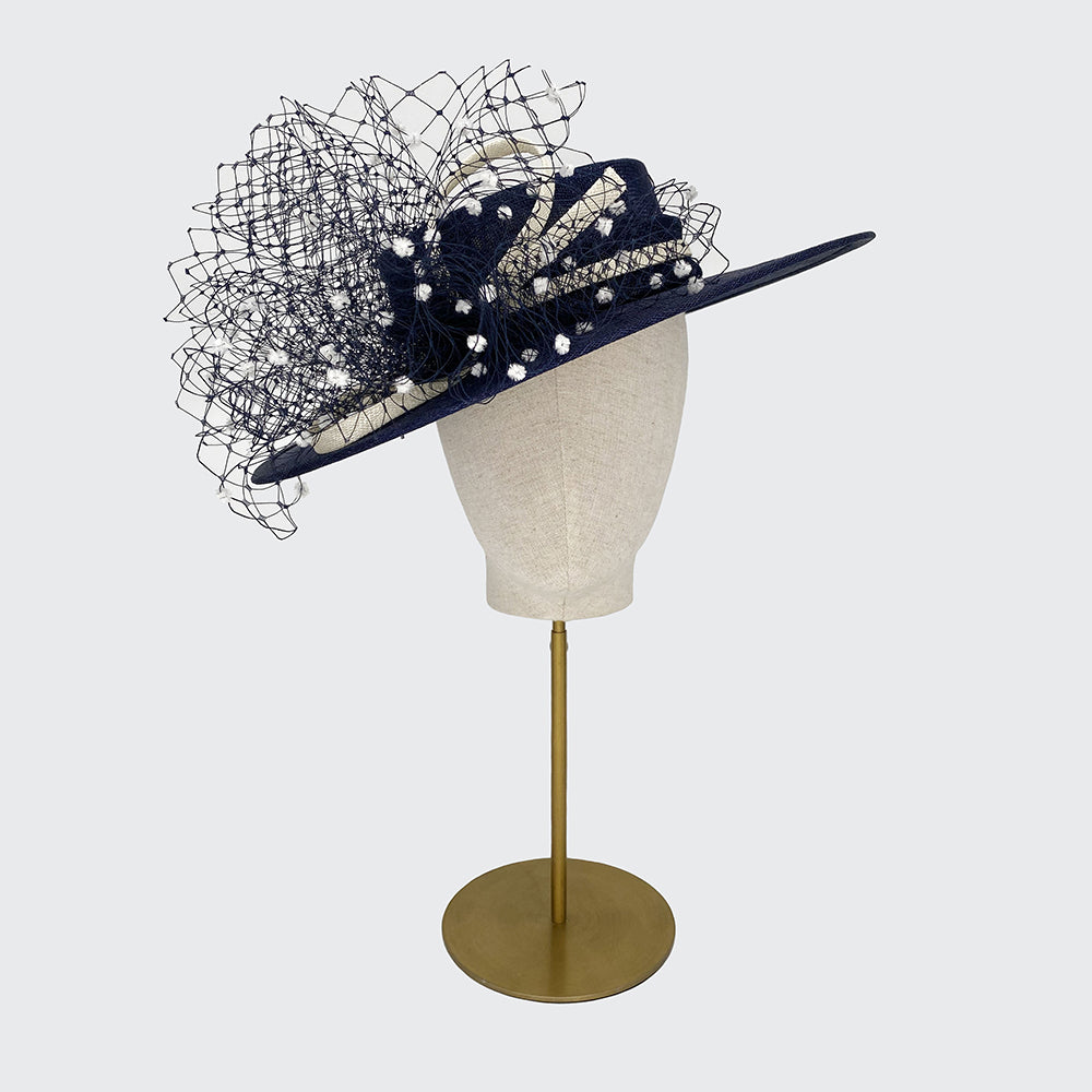 Navy straw boater with ivory stripe and spot veiling choux