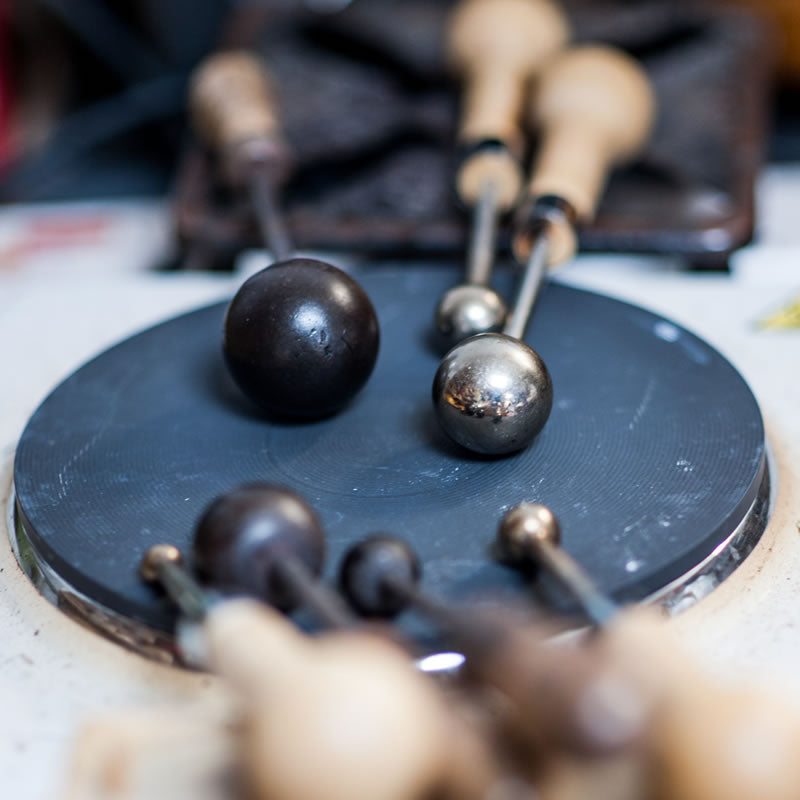 Antique flower making tool on a hot plate