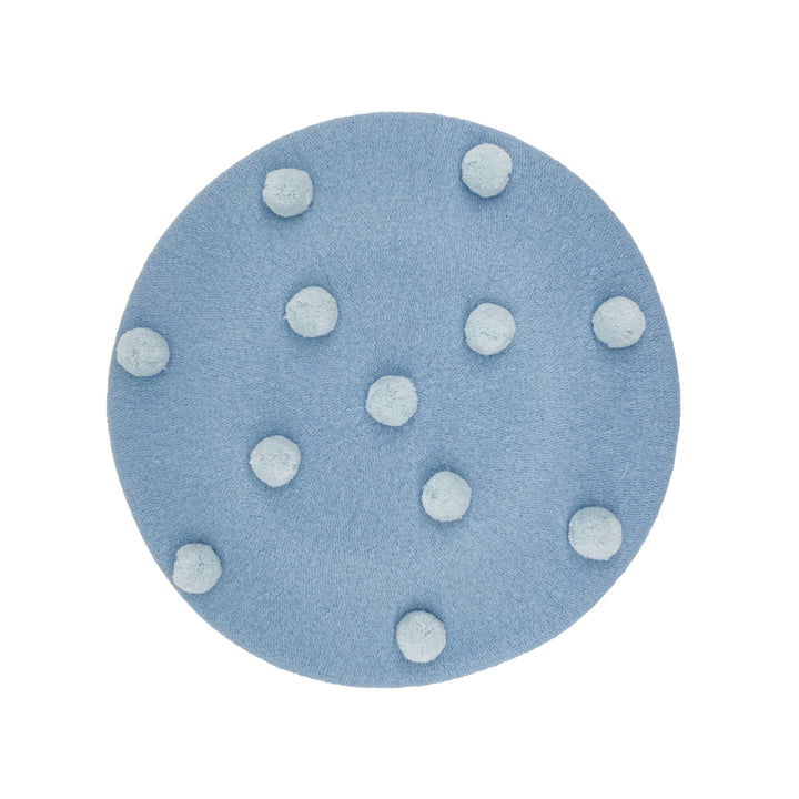 Photo of a pale blue wool beret with pale blue pom poms 