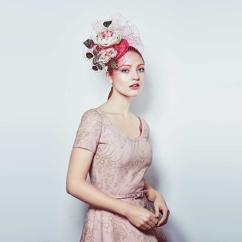 Lipstick pink mini pillbox with toned roses and veil
