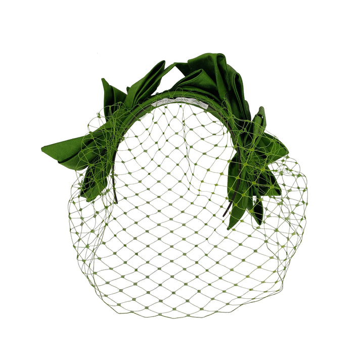 Photo of a green silk bow headband with face veil