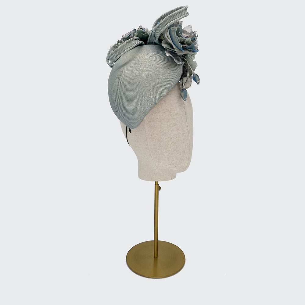 Pale silvery blue teardrop pillbox with silk flowers and loops
