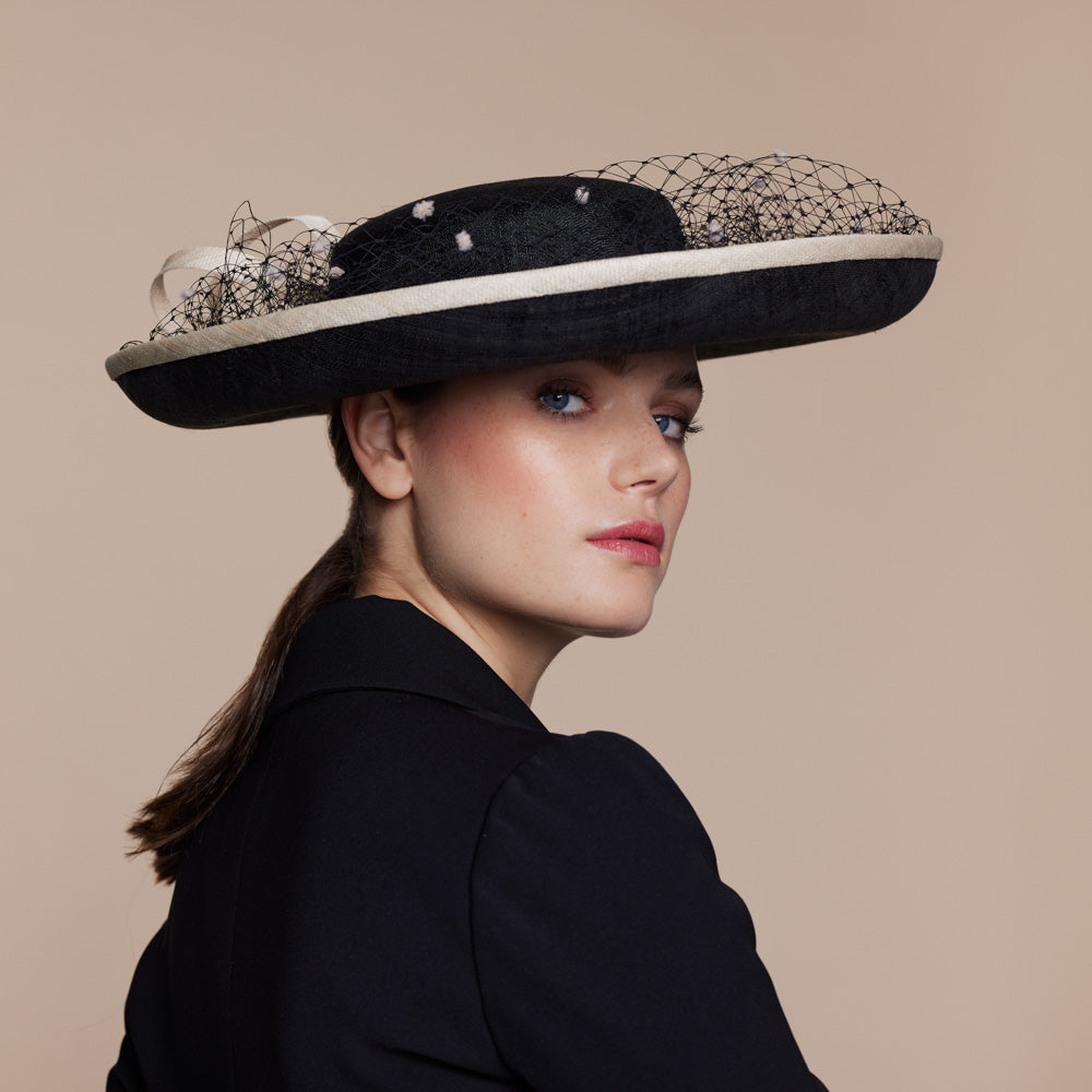Black Breton hat with black veiling and natural spots