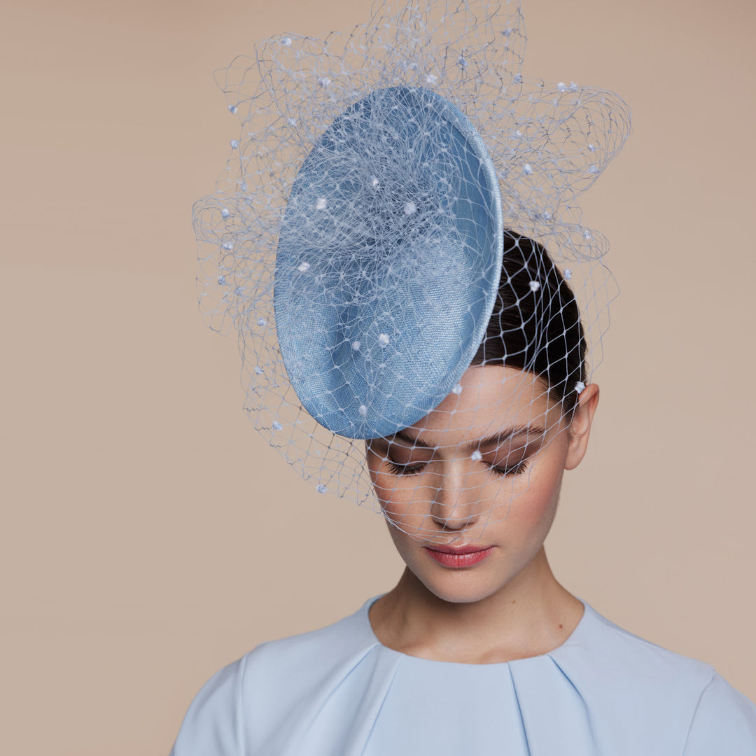 Pale blue straw disc with spot veiling