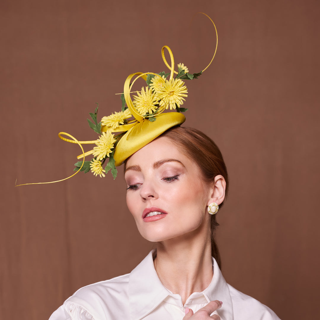 Yellow silk pillbox with flowers and quills