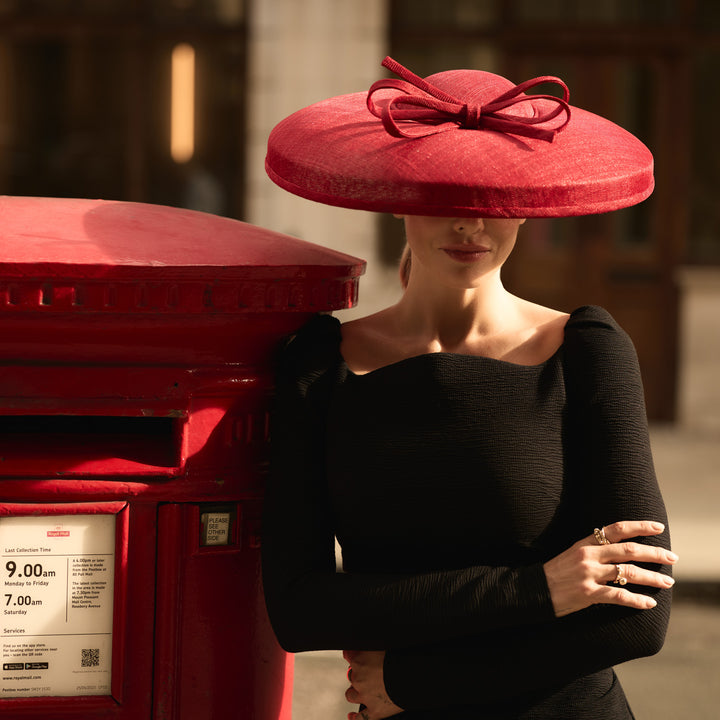 Red fine straw downbrim with skinny bow