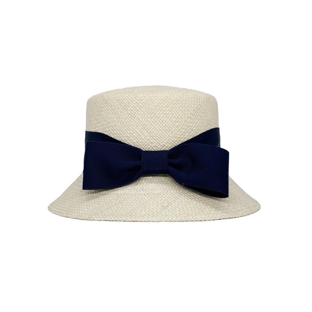 Photo of a panama bucket hat with a navy bow