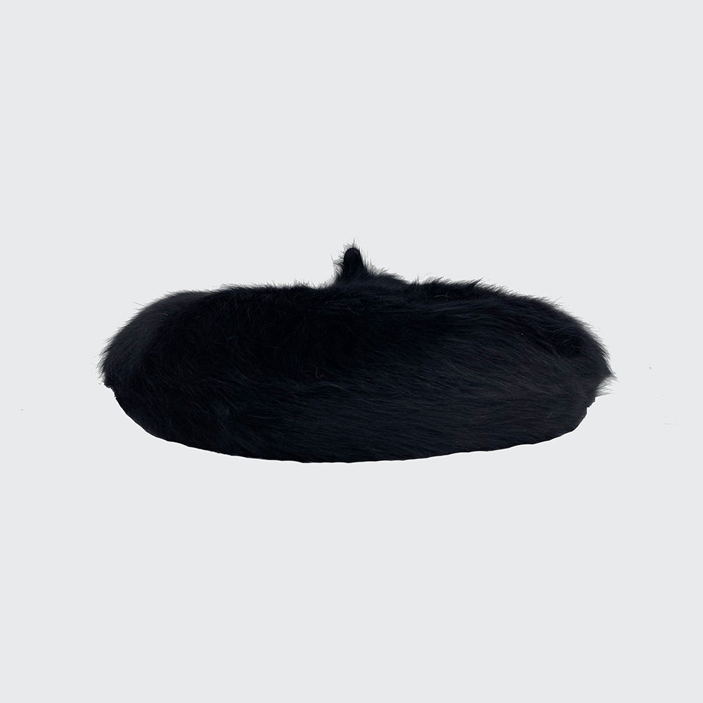 Side view of a black angora beret