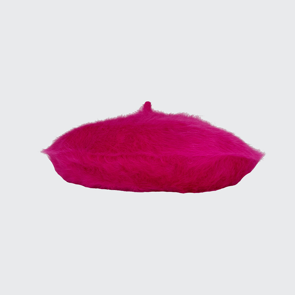 Side view of a hot pink angora beret