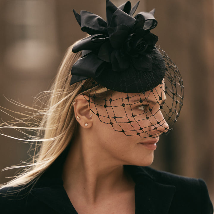 Black silk pillbox with bows, silk flowers and veil
