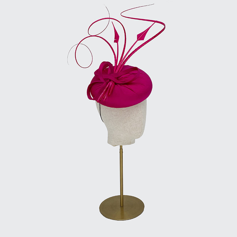 Bright pink silk pillbox with feathers and quills