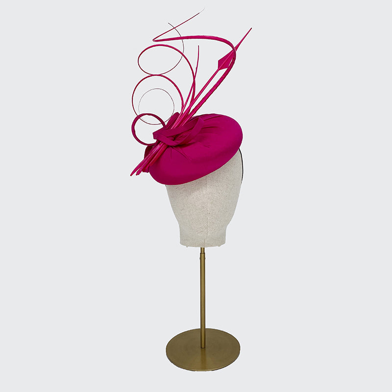 Bright pink silk pillbox with feathers and quills