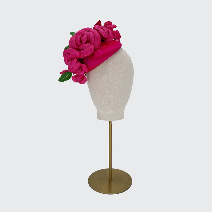 Deep pink silk pillbox with camellias