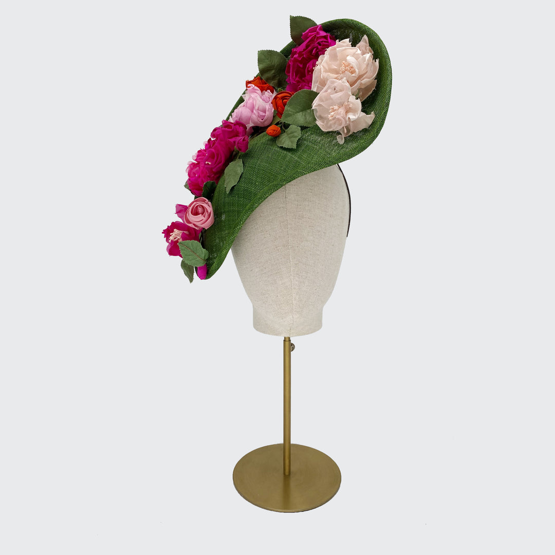 Green leaf disc with pink toned silk flowers