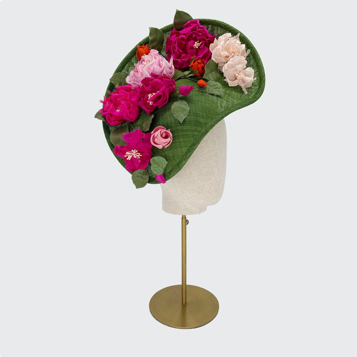 Green leaf disc with pink toned silk flowers