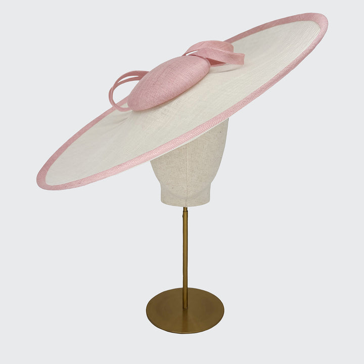 Large ivory and pale pink disc with bow