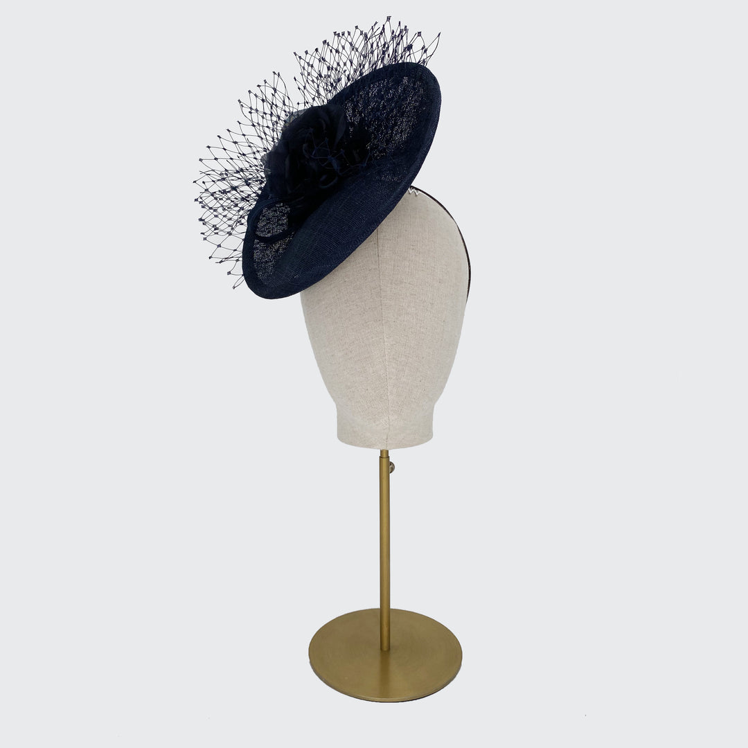 Navy disc with silk flowers and veiling