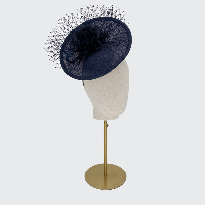 Navy disc with silk flowers and veiling
