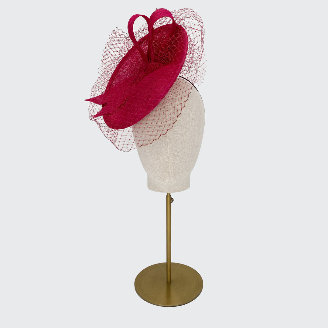 Pink disc with fine veiling and bow