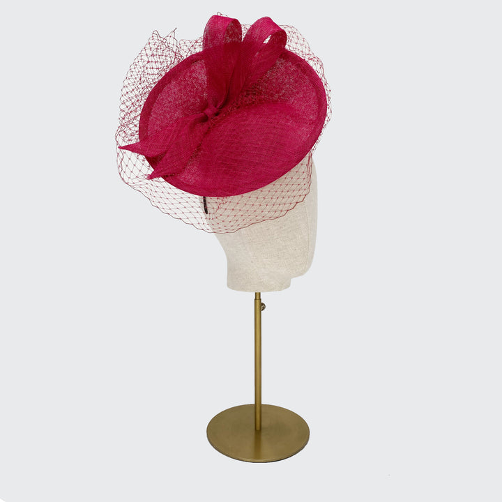 Pink disc with fine veiling and bow