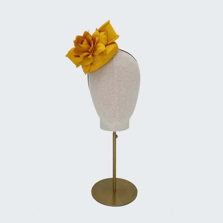 Yellow paribuntal straw pillbox with flower and bow