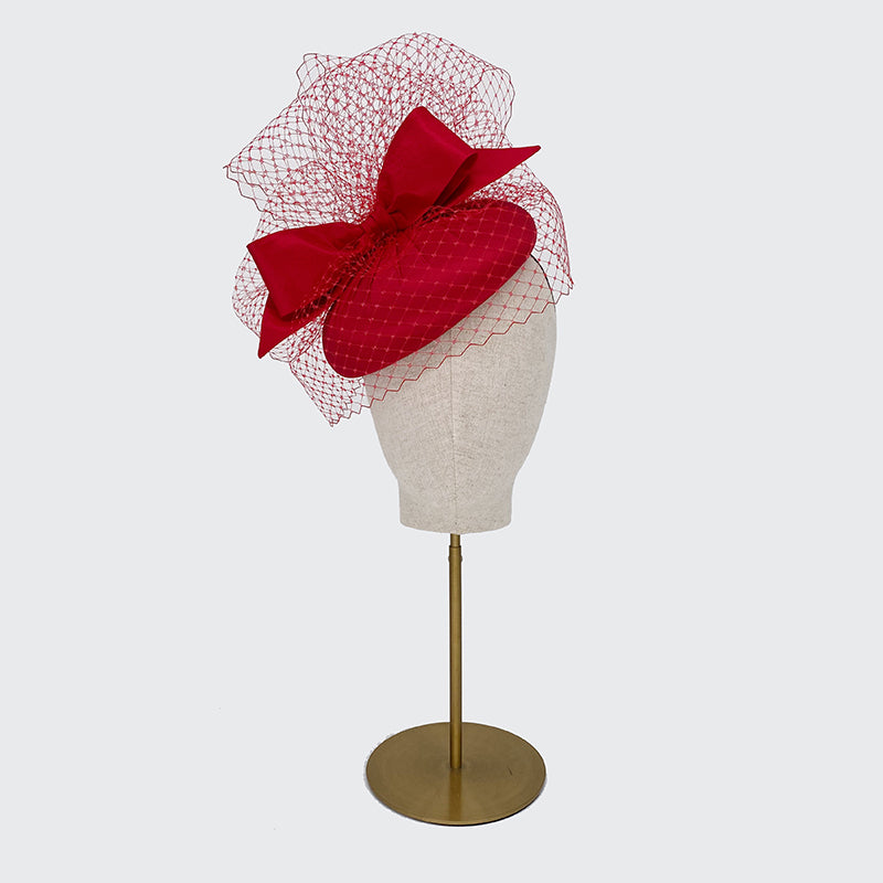 Large red silk pillbox with veil and bow