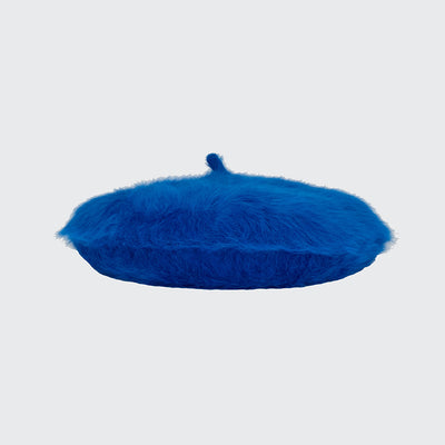 Side view of a royal blue angora beret