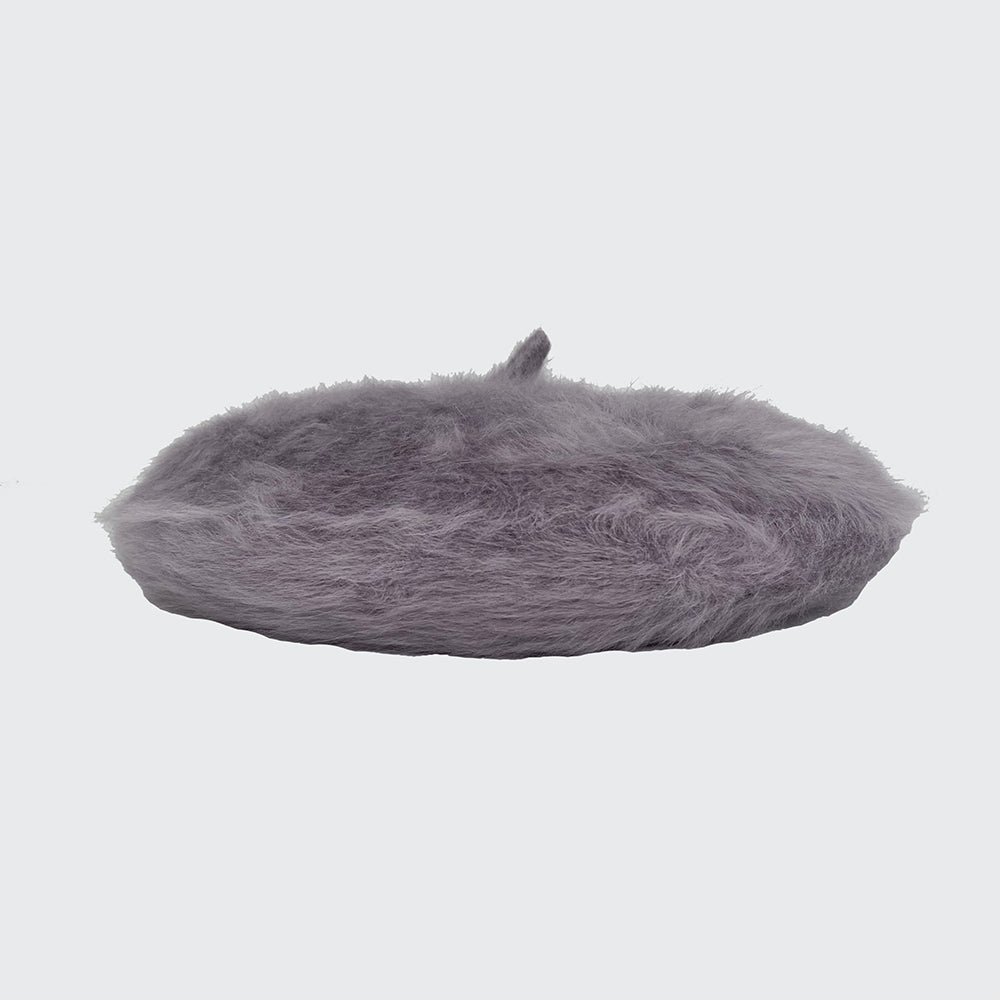Side view of a silver grey angora beret