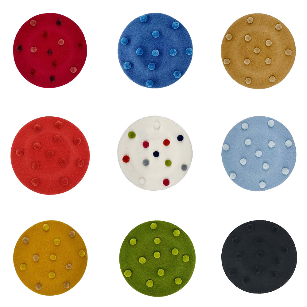 Photo of a selection of wool berets with pom poms in different colours