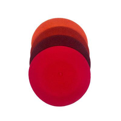 Photo of 4 orange and red wool berets