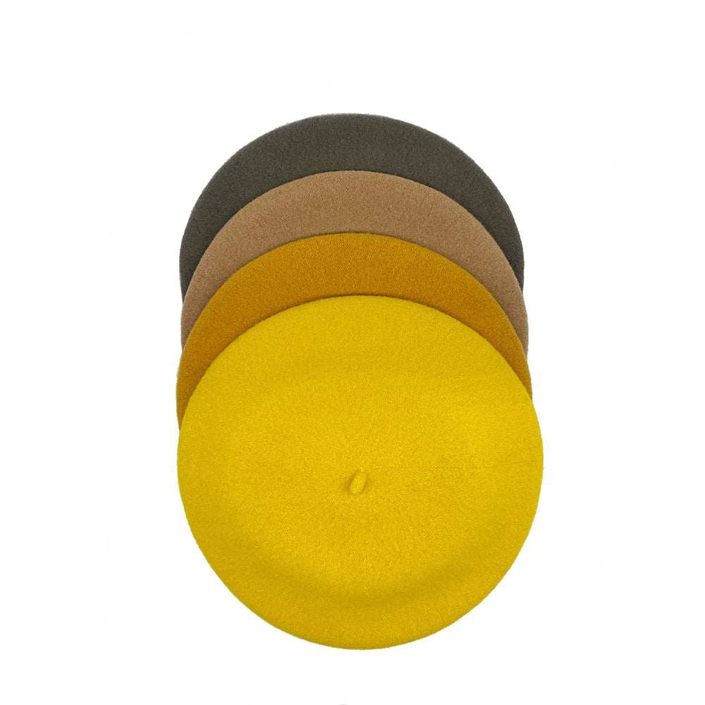 Photo of 4 yellow, gold and green wool berets