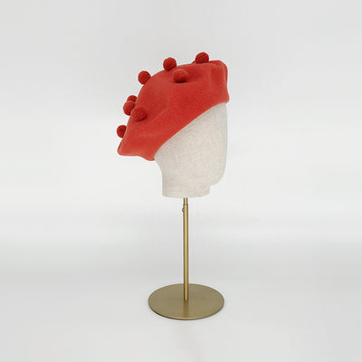 Burnt orange pom pom beret