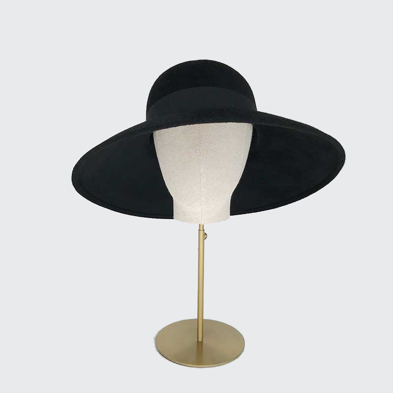Photo of black velour felt downbrim with a grosgrain band on a linen display head