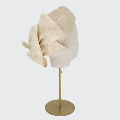 Photo of a natural fine straw Jackie O pillbox with bows on a linen display head