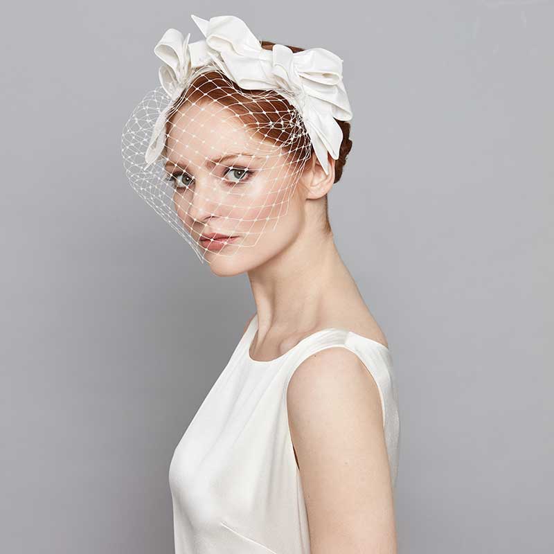 Bride wearing a bow headband with veil