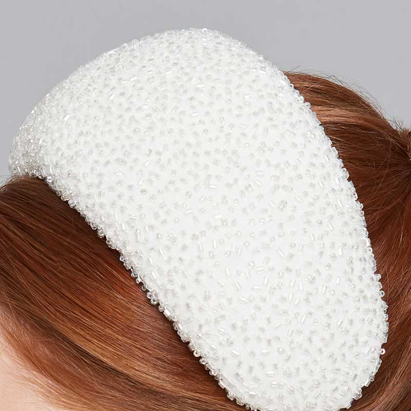 Close up of a beaded silk wide headband