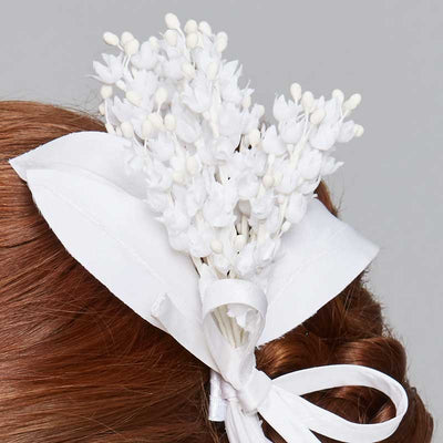 Close up of Lily of the valley comb with a bow