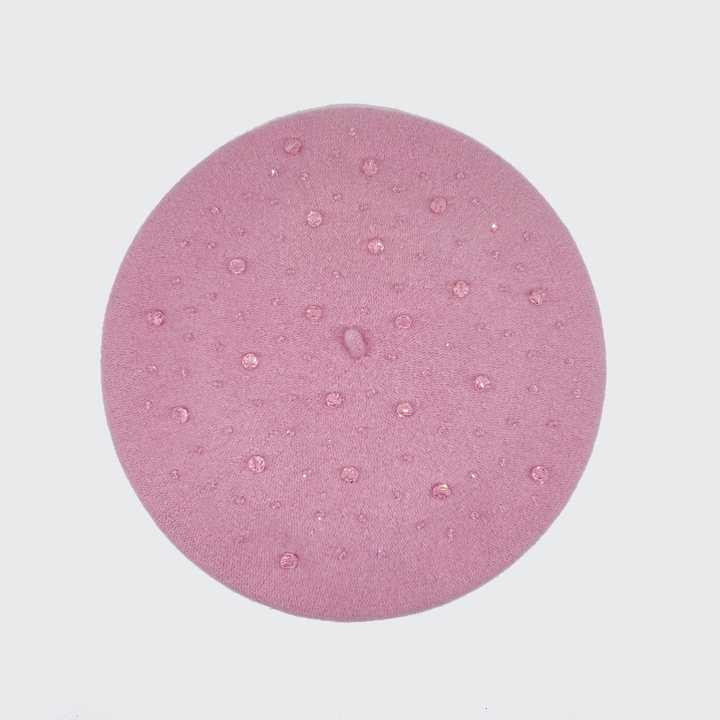 Photo of a pale pink wool beret with crystals