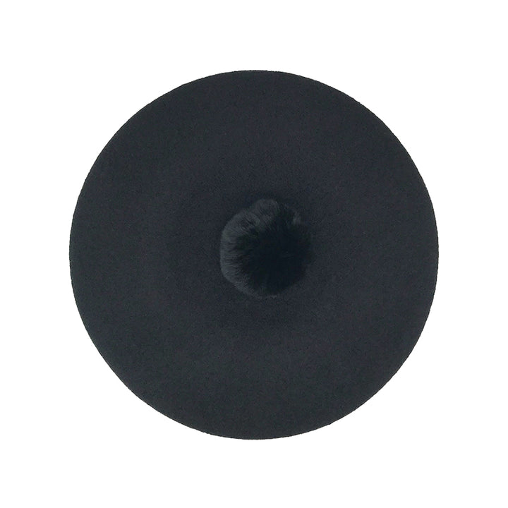 Photo of black wool beret with black fur pom