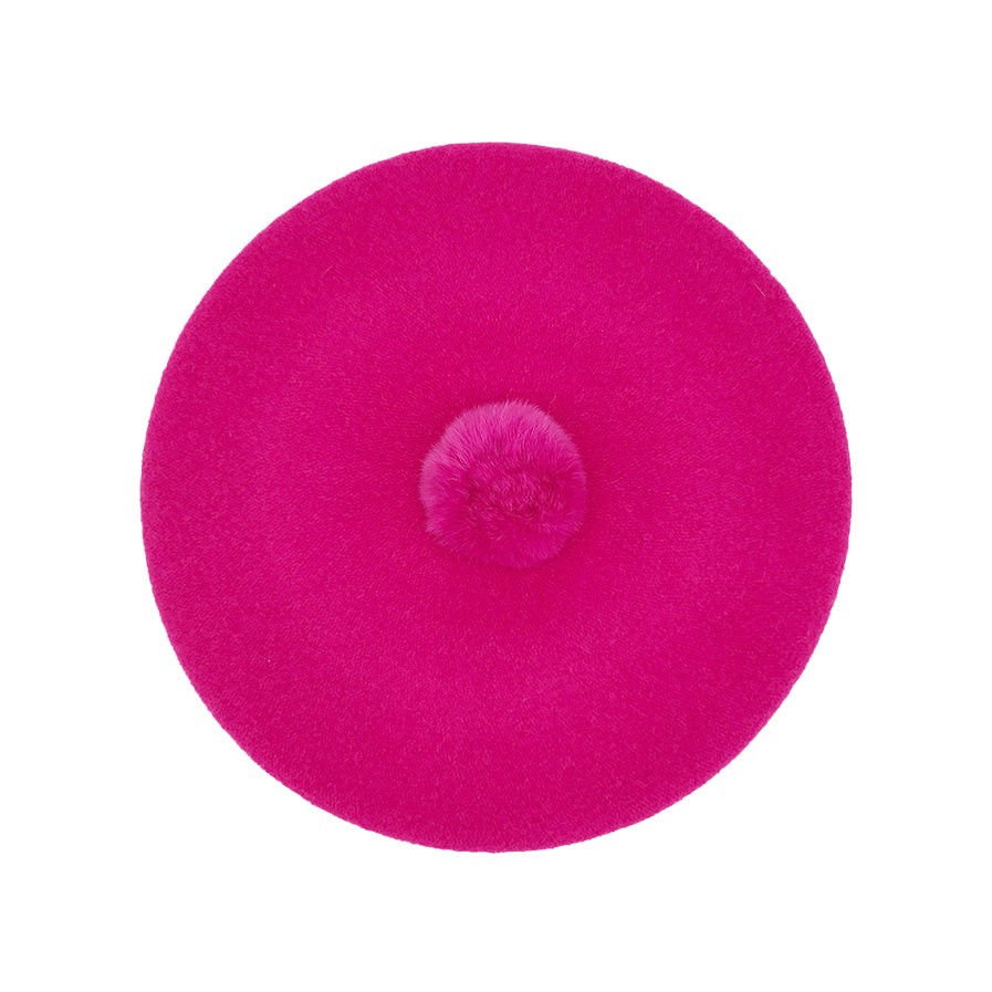 Photo of hot pink wool beret with hot pink fur pom