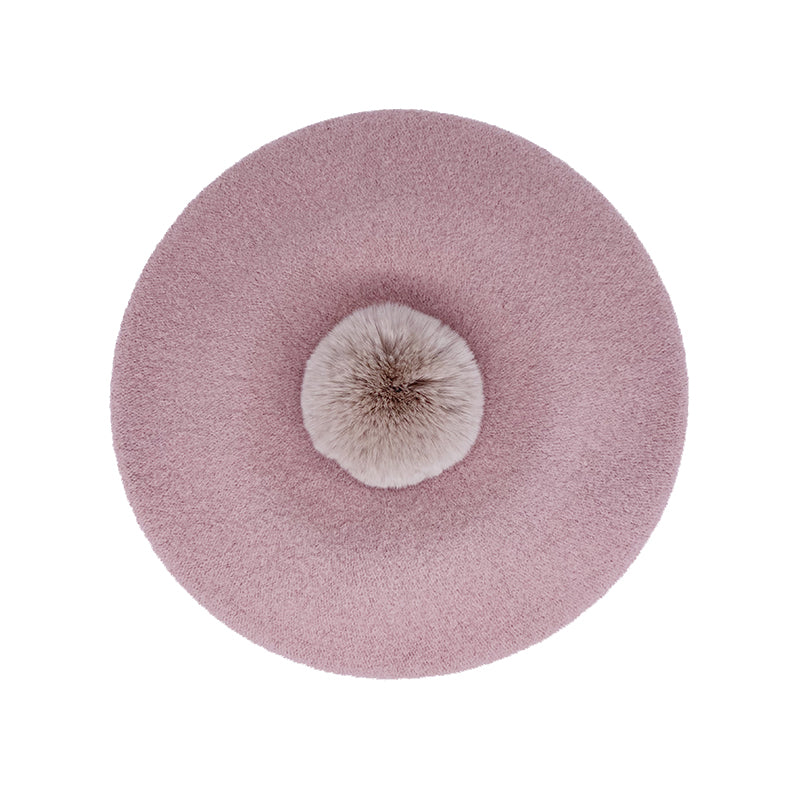 Photo of powder pink wool beret with nude fur pom