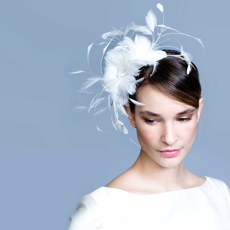 Bride wearing a soft feather flower headband