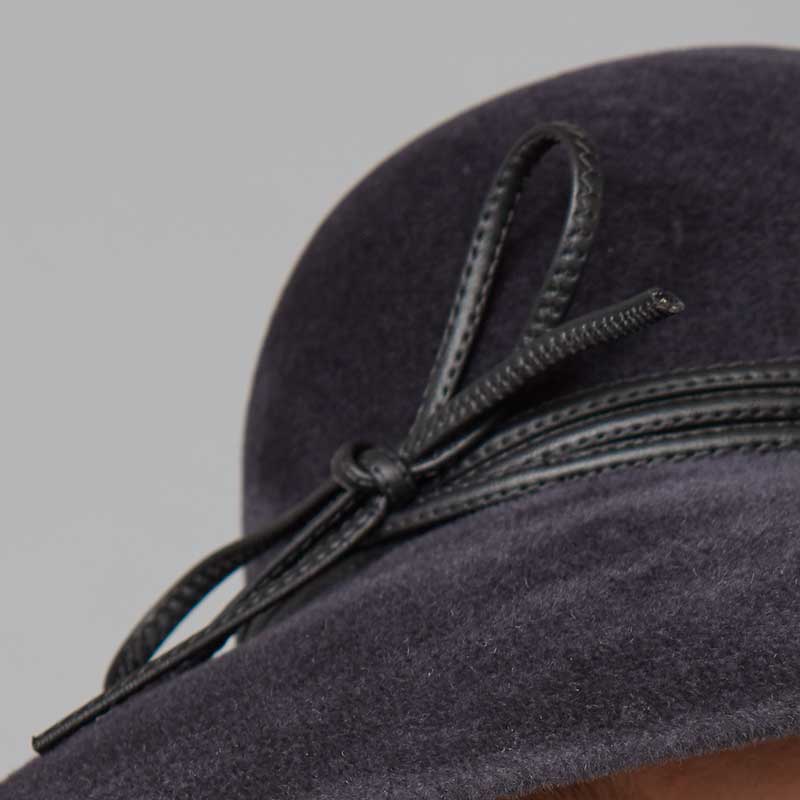 Close up of a slate grey velour felt downbrim with a leather cord trim