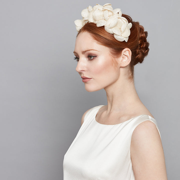 Ivory wearing a fine straw petal headband