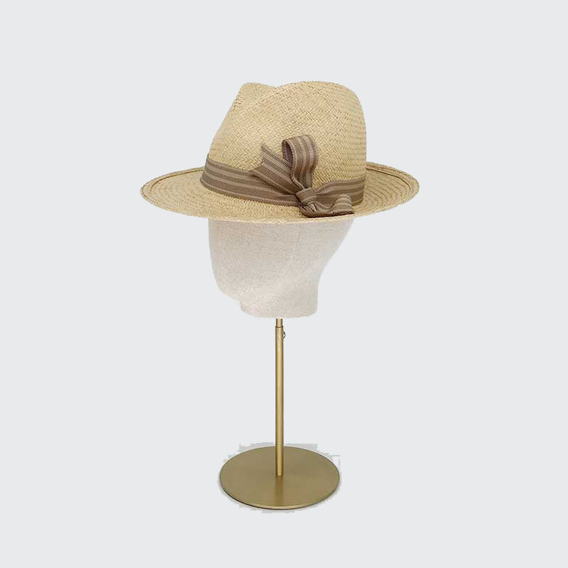 Photo of a dark natural panama trilby with striped grosgrain band and bow