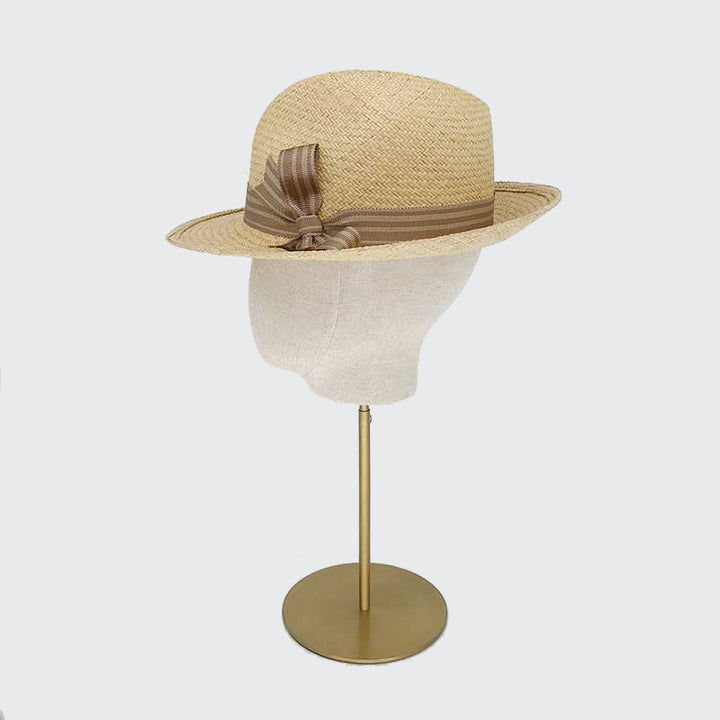 Photo of a dark natural panama trilby with striped grosgrain band and bow